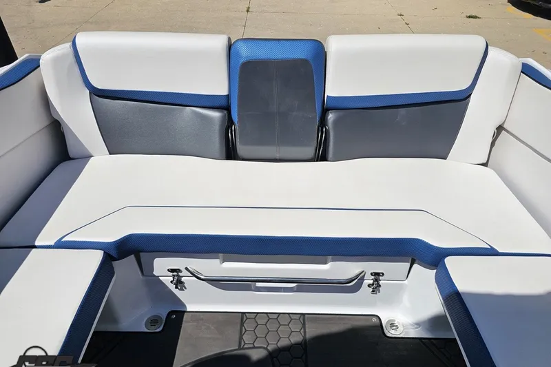 Slide: The Image of 2022 Scarab 255 Wake ID boat interior with blue and white seating. - 110