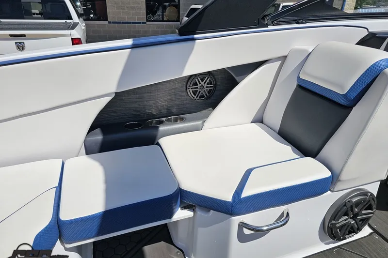 Slide: The Image of Interior seating of 2022 Scarab 255 Wake ID boat with blue and white upholstery. - 51