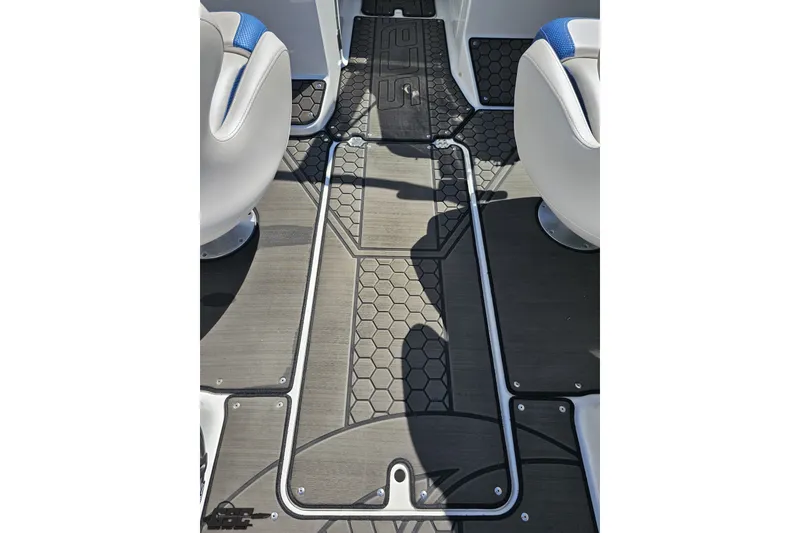 Slide: The Image of 2022 Scarab 255 Wake ID boat interior with hexagonal floor design and white seating. - 61