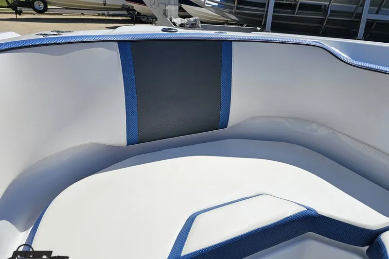 Slide: The Image of 2022 Scarab 255 Wake ID boat interior with blue and white seating. - 96