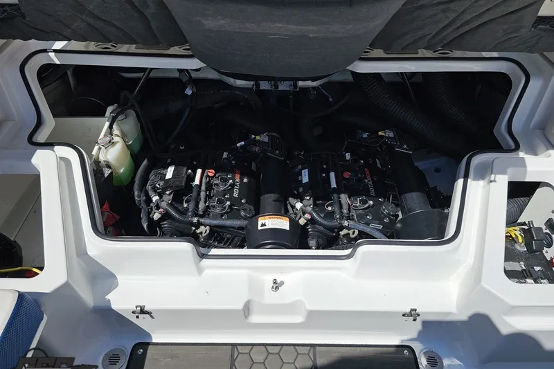 Slide: The Image of Engine compartment of 2022 Scarab 255 Wake ID boat, showcasing dual Rotax engines. - 115