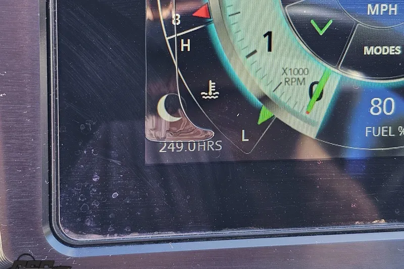 Slide: The Image of Dashboard display of a 2022 Scarab 255 Wake ID showing 249 hours and RPM gauge. - 75