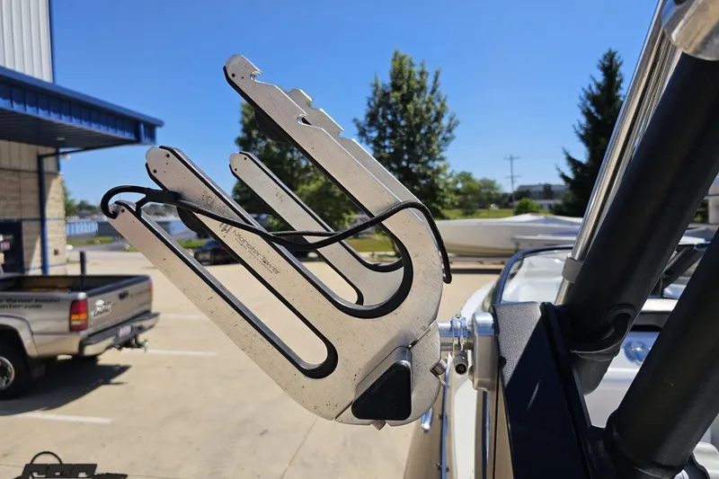 Slide: The Image of Wakeboard rack on a 2022 Scarab 255 Wake ID boat, sunny day background. - 56