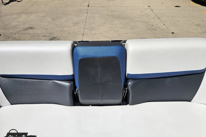 Slide: The Image of Rear seating of 2022 Scarab 255 Wake ID boat, featuring blue and black upholstery. - 113