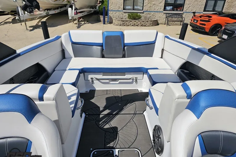 Slide: The Image of Interior of 2022 Scarab 255 Wake ID boat with blue and white seating. - 104