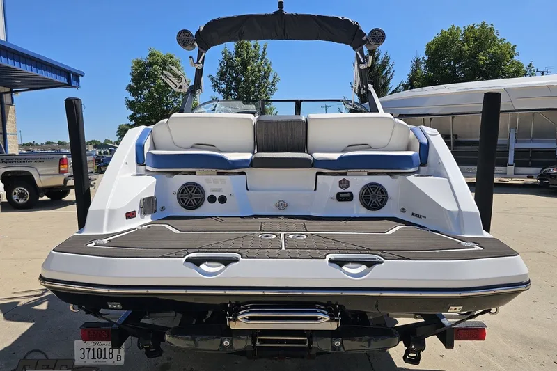 Slide: The Image of 2022 Scarab 255 Wake ID boat, rear view, showcasing deck and seating area. - 30