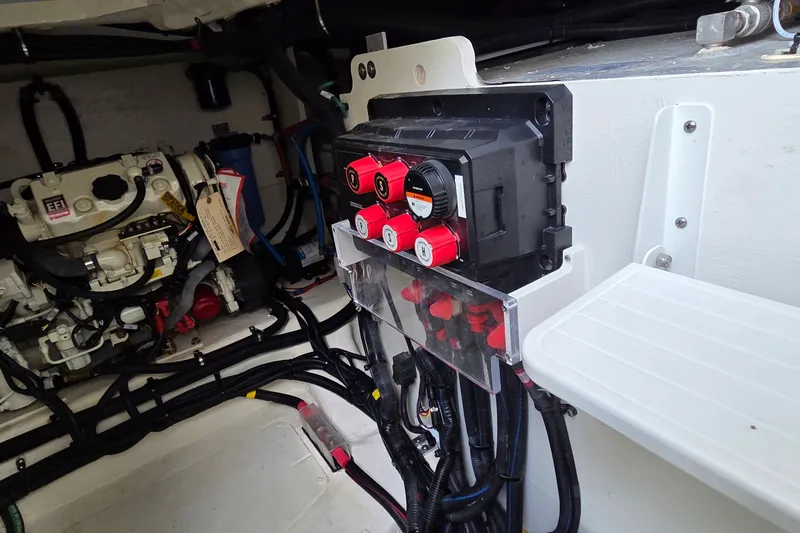 Slide: The Image of Engine compartment of 2023 Sea Ray Sundancer 370 Outboard, showcasing electrical components and wiring. - 28