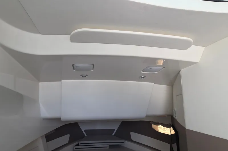 Slide: The Image of Interior ceiling of 2023 Sea Ray Sundancer 370 Outboard, featuring modern design elements. - 19