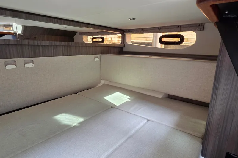 Slide: The Image of 2023 Sea Ray Sundancer 370 Outboard cabin interior with modern design and comfortable seating. - 26