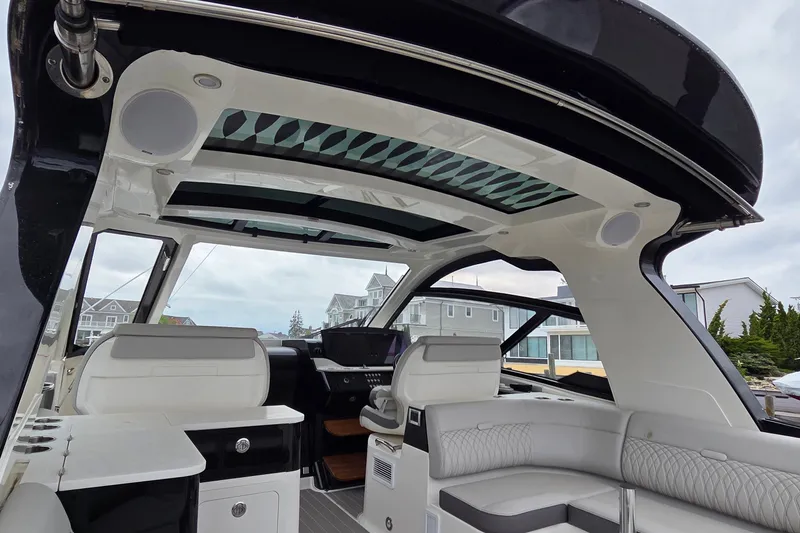 Slide: The Image of 2023 Sea Ray Sundancer 370 Outboard interior with modern seating and sleek design. - 9
