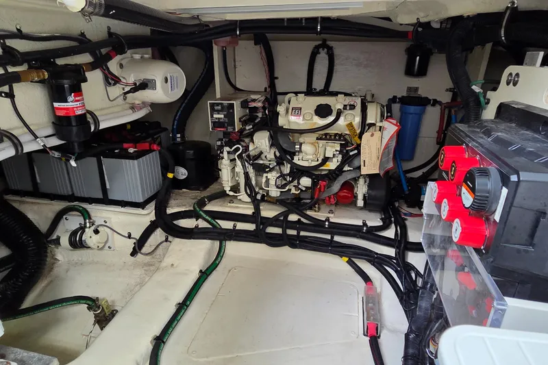 Slide: The Image of Engine compartment of 2023 Sea Ray Sundancer 370 Outboard, showcasing wiring and components. - 27
