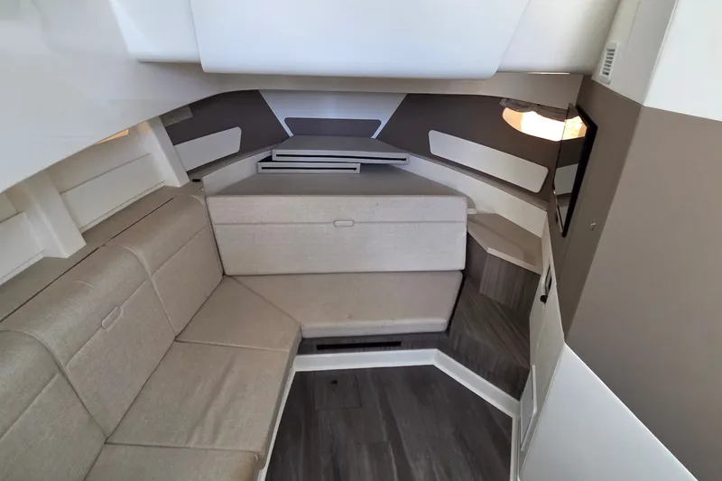 Slide: The Image of Interior cabin of 2023 Sea Ray Sundancer 370 Outboard with modern seating and sleek design. - 20