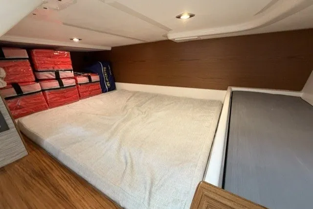 Slide: The Image of Interior cabin of 2025 Tiara Yachts 43 LS with bed and storage space. - 28