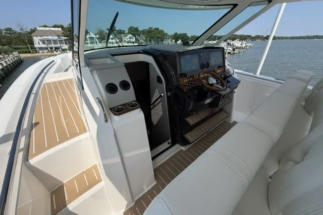 Slide: The Image of 2025 Tiara Yachts 43 LS cockpit with modern controls and luxurious seating. - 16