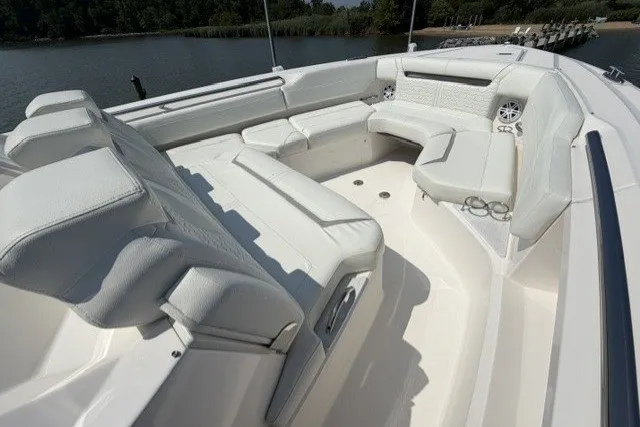 Slide: The Image of Luxurious seating area on 2025 Tiara Yachts 43 LS, featuring elegant white upholstery. - 11
