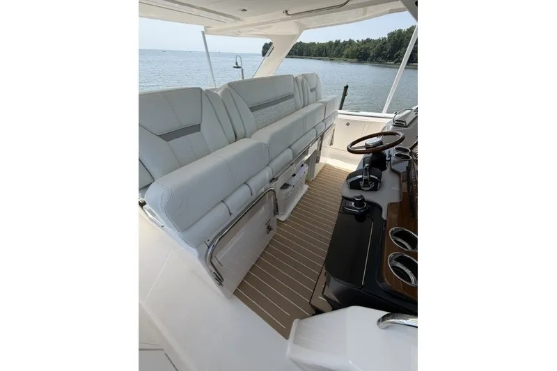 Slide: The Image of Luxurious interior of 2025 Tiara Yachts 43 LS with plush seating and elegant helm. - 12