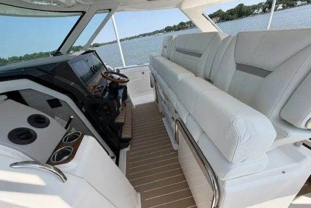 Slide: The Image of 2025 Tiara Yachts 43 LS interior with luxurious seating and modern helm. - 13