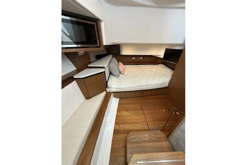Slide: The Image of Luxurious cabin interior of 2025 Tiara Yachts 43 LS with modern wood finishes. - 27