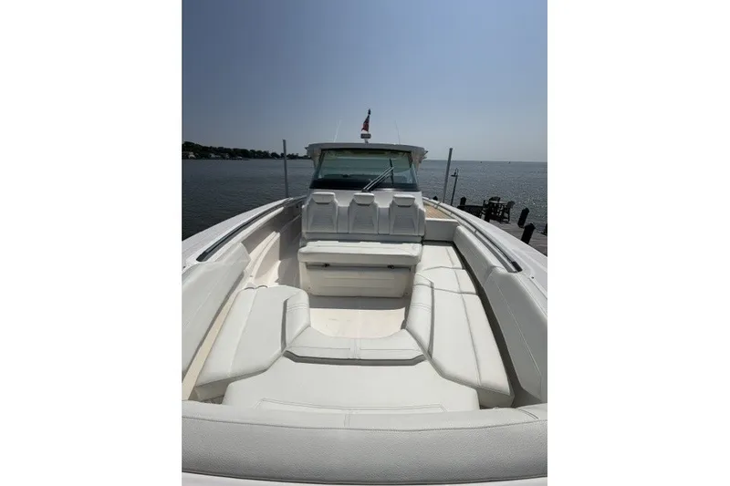 Slide: The Image of 2025 Tiara Yachts 43 LS luxury boat with spacious seating on calm waters. - 8