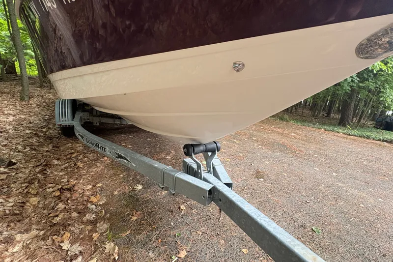 Slide: The Image of 2006 Cobalt 220 boat on Load Rite trailer in wooded area. - 10