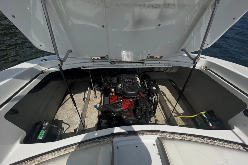 Slide: The Image of Open engine compartment of a 2006 Cobalt 220 boat, showing engine and battery. - 3