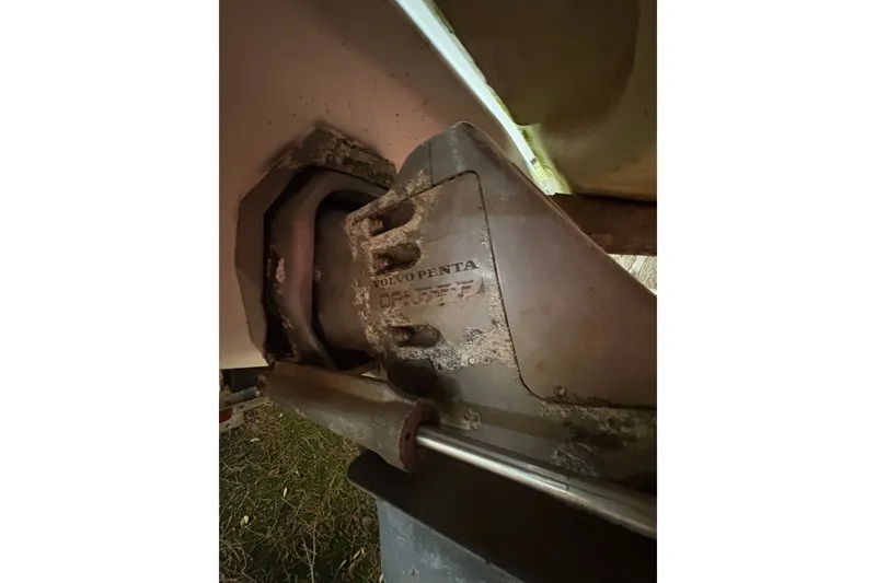 Slide: The Image of Close-up of a 2006 Cobalt 220 boat's Volvo Penta outdrive, showing wear and corrosion. - 7