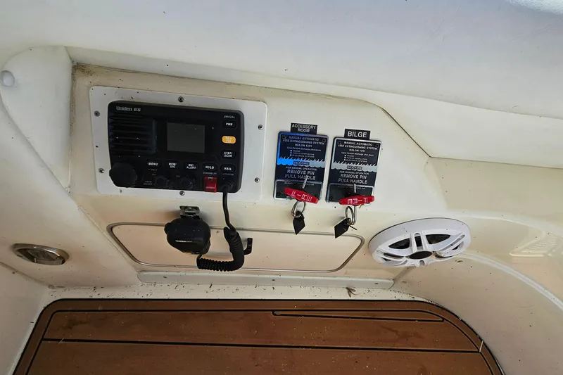 Slide: The Image of Control panel of a 1995 Sea Ray 500 Sundancer boat with radio and speaker. - 22