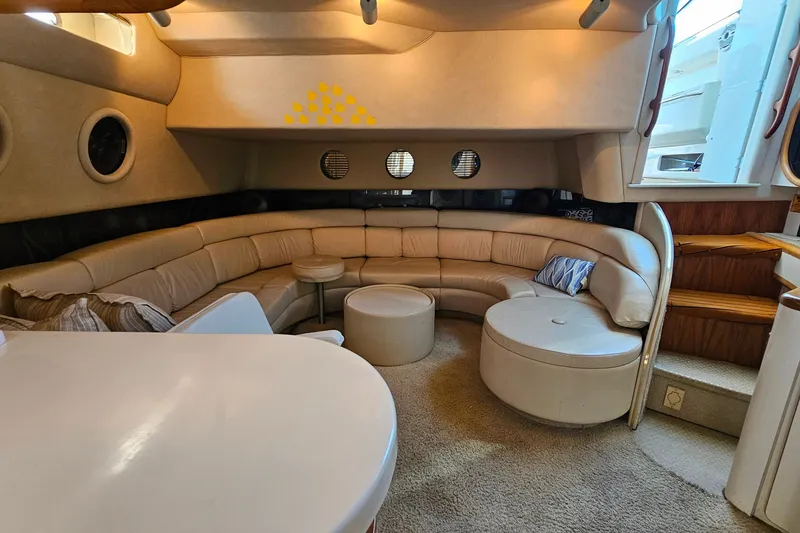 Slide: The Image of Luxurious interior of a 1995 Sea Ray 500 Sundancer yacht with plush seating. - 33