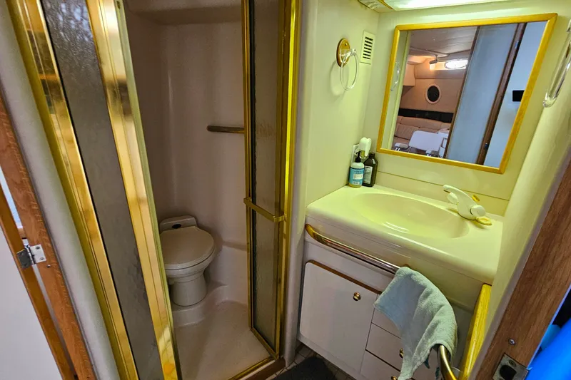 Slide: The Image of Bathroom interior of 1995 Sea Ray 500 Sundancer yacht, featuring shower and sink. - 41