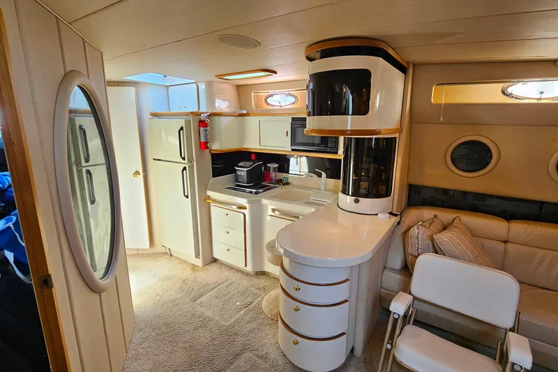 Slide: The Image of Luxurious interior of a 1995 Sea Ray 500 Sundancer yacht with modern amenities. - 26