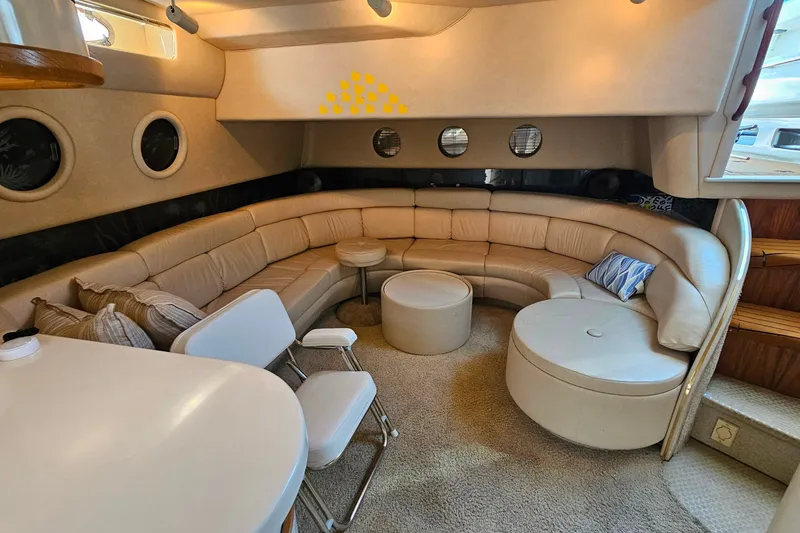 Slide: The Image of Luxurious interior of a 1995 Sea Ray 500 Sundancer yacht with plush seating and modern design. - 27