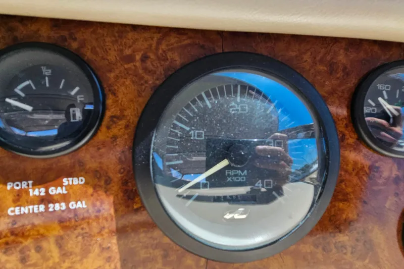 Slide: The Image of Dashboard gauges of a 1995 Sea Ray 500 Sundancer boat. - 20