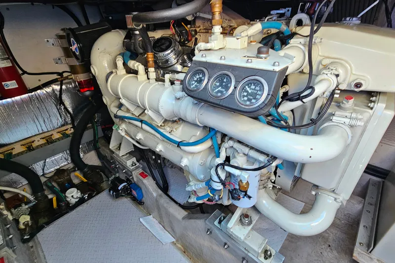 Slide: The Image of Engine room of a 1995 Sea Ray 500 Sundancer, showcasing detailed mechanical components. - 44