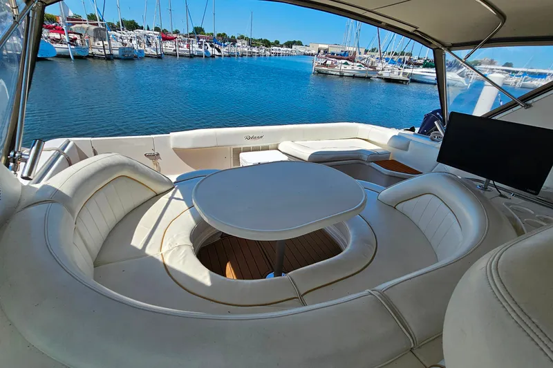 Slide: The Image of Luxurious 1995 Sea Ray 500 Sundancer yacht interior with elegant seating and marina view. - 18