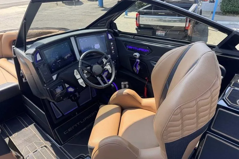 Slide: The Image of Interior of a 2025 Centurion Ri245 boat with advanced dashboard and luxurious seating. - 18