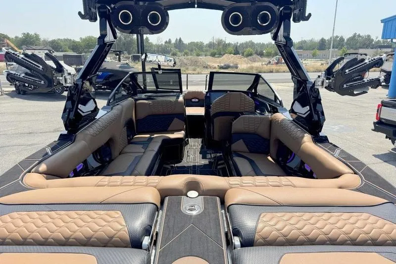 Slide: The Image of Luxurious interior of 2025 Centurion Ri245 boat with plush seating and advanced audio system. - 16