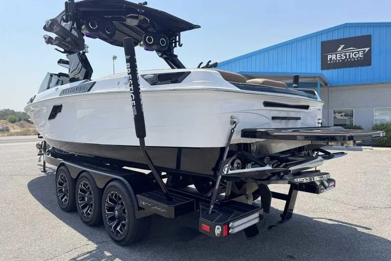 Slide: The Image of 2025 Centurion Ri245 boat on trailer at Prestige Water Sports dealership. - 19