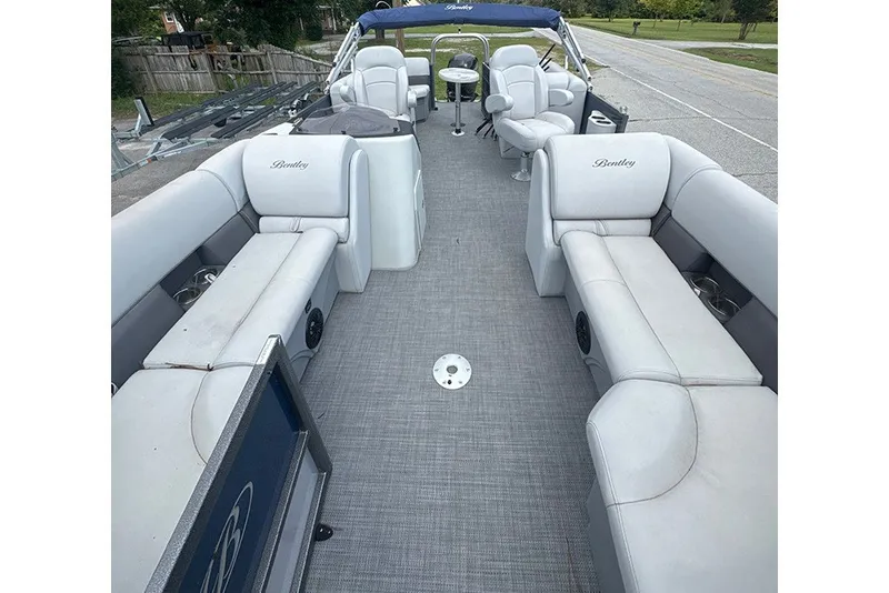 Slide: The Image of 2023 Bentley Pontoons Legacy Navigator 223 interior with plush seating and modern design. - 6
