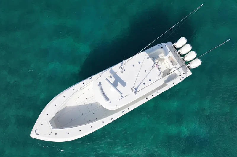 Slide: The Image of Aerial view of 2022 SeaVee 390Z boat on clear turquoise water. - 3