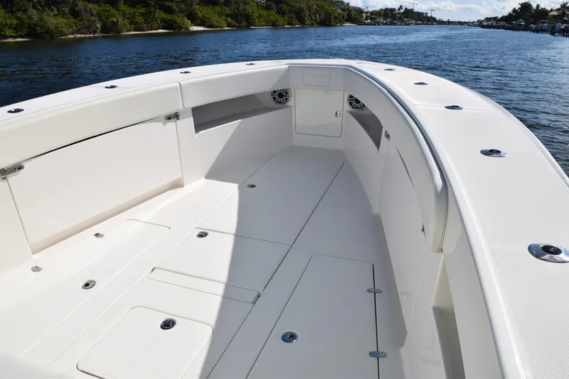Slide: The Image of 2022 SeaVee 390Z boat deck, spacious and sleek design on calm water. - 33