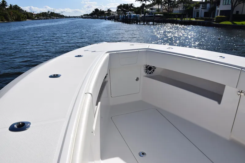 Slide: The Image of 2022 SeaVee 390Z boat interior with sleek design, cruising on a sunny waterway. - 34