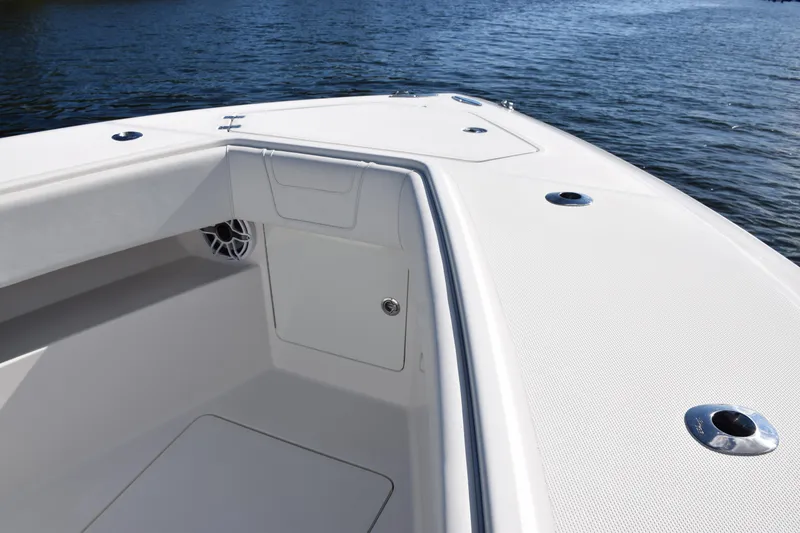 Slide: The Image of 2022 SeaVee 390Z boat deck with sleek design on calm water. - 30