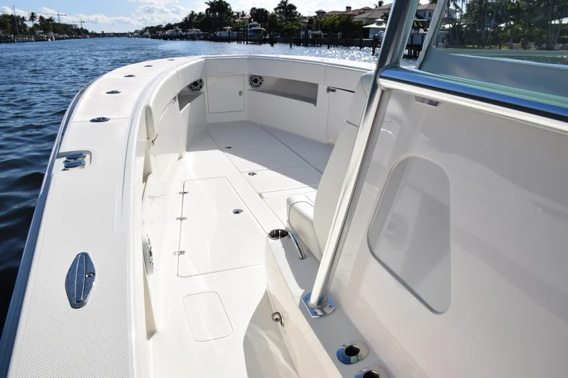Slide: The Image of 2022 SeaVee 390Z boat interior, showcasing spacious deck and sleek design on a sunny day. - 28