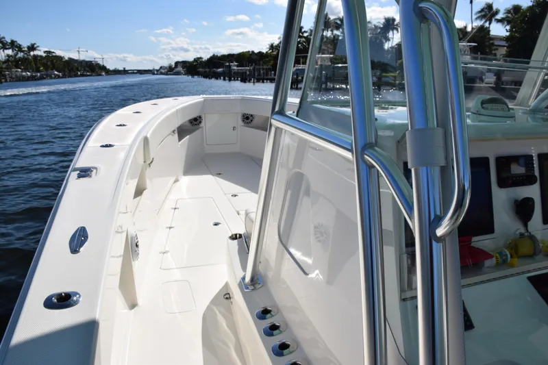 Slide: The Image of 2022 SeaVee 390Z boat on water, showcasing sleek design and spacious deck. - 25