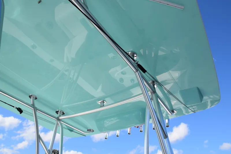 Slide: The Image of 2022 SeaVee 390Z boat canopy with stainless steel supports against blue sky. - 7