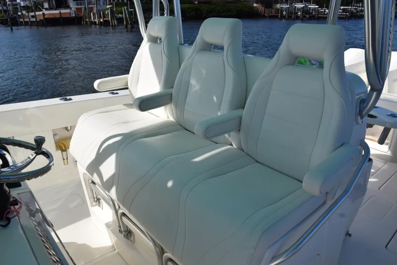 Slide: The Image of Luxury seating on 2022 SeaVee 390Z boat, featuring plush white upholstery and armrests. - 20
