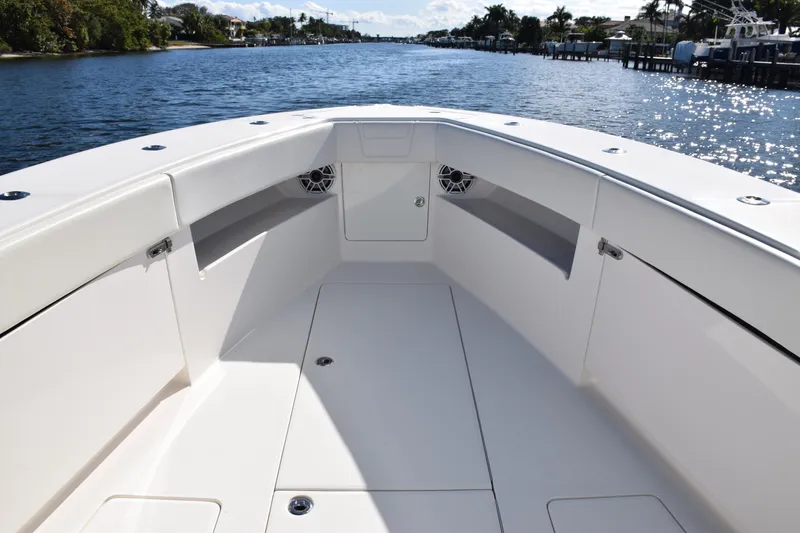 Slide: The Image of 2022 SeaVee 390Z boat interior with spacious deck and scenic waterway view. - 29