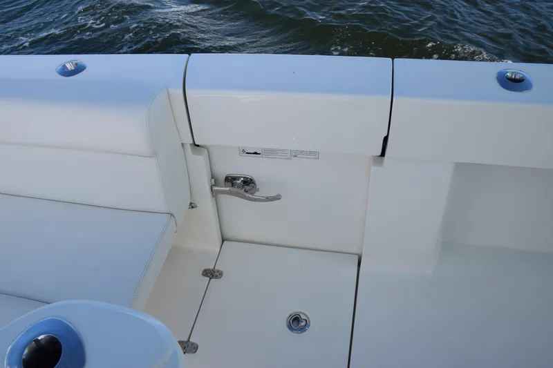 Slide: The Image of 2022 SeaVee 390Z boat interior with white seating and ocean backdrop. - 5