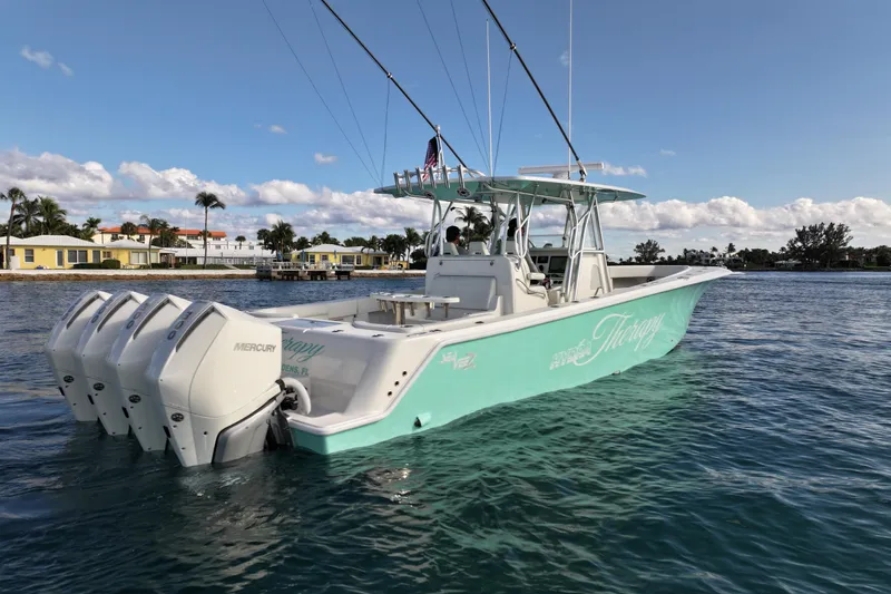 Slide: The Image of 2022 SeaVee 390Z boat with multiple outboard engines on calm water. - 38