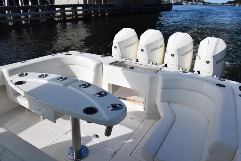 Slide: The Image of 2022 SeaVee 390Z boat interior with seating and multiple Mercury outboard engines. - 12